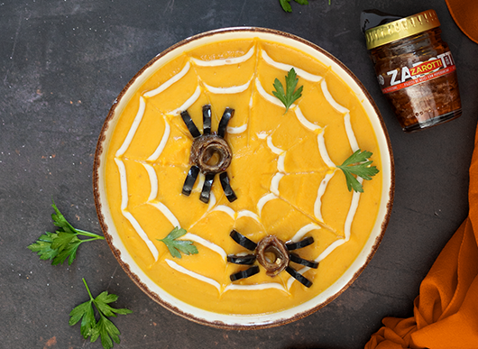 Vellutata di zucca con filetti di alici con peperoncino